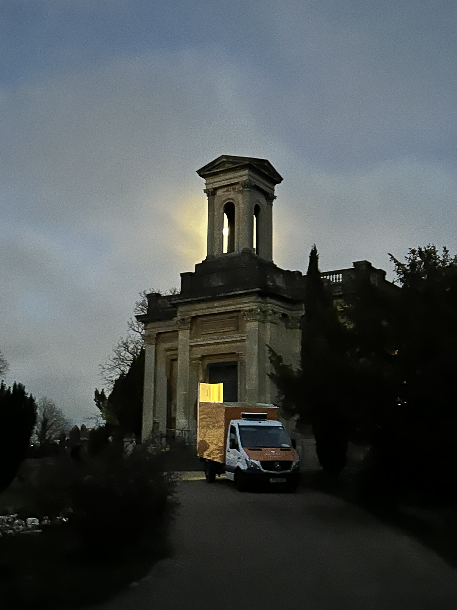 Exterior in dusk and moonlight of Anglican chapel / alt text