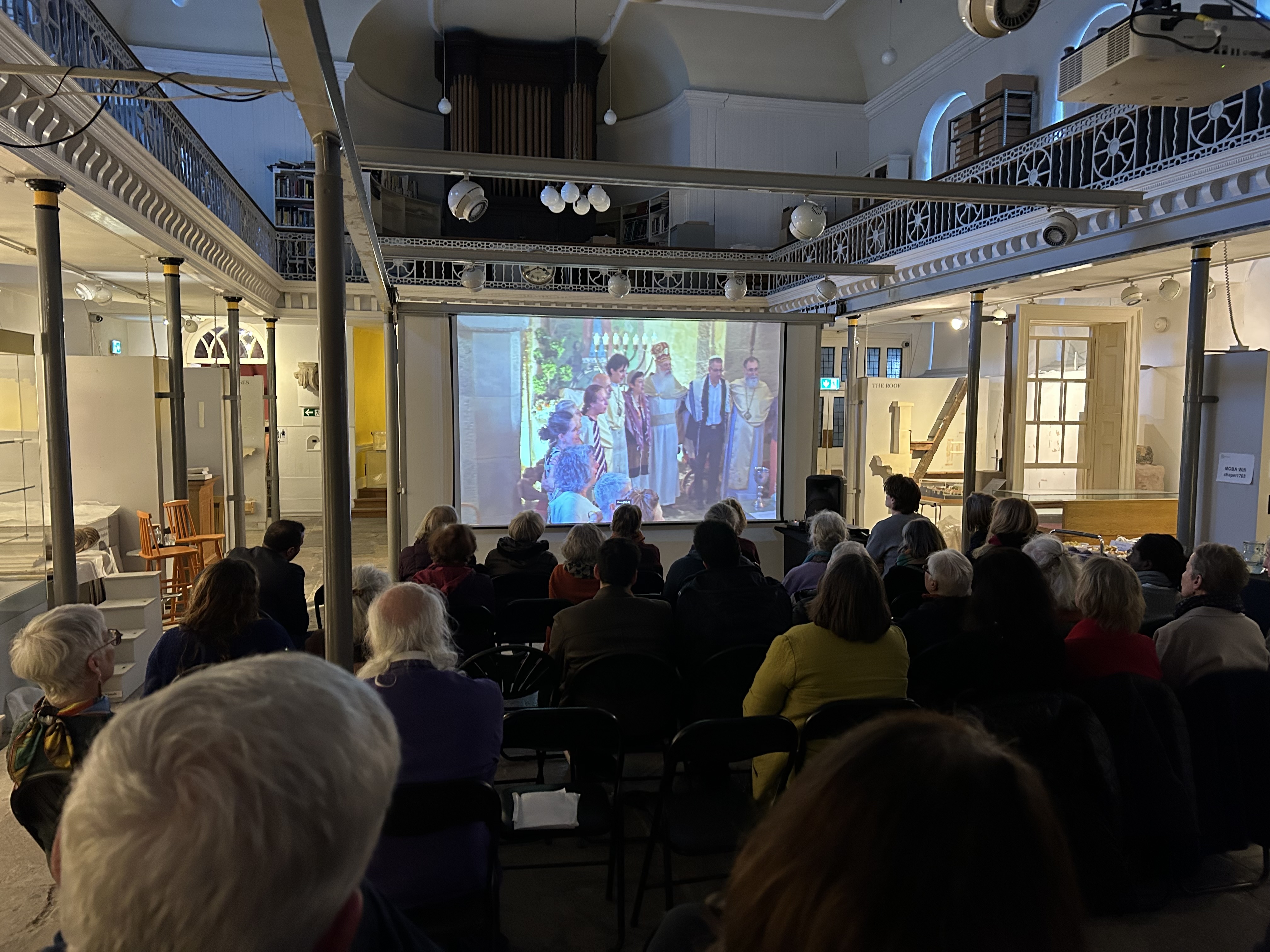 Guests enjoy the Peace Project film showing at Countess of Huntingford's chapel